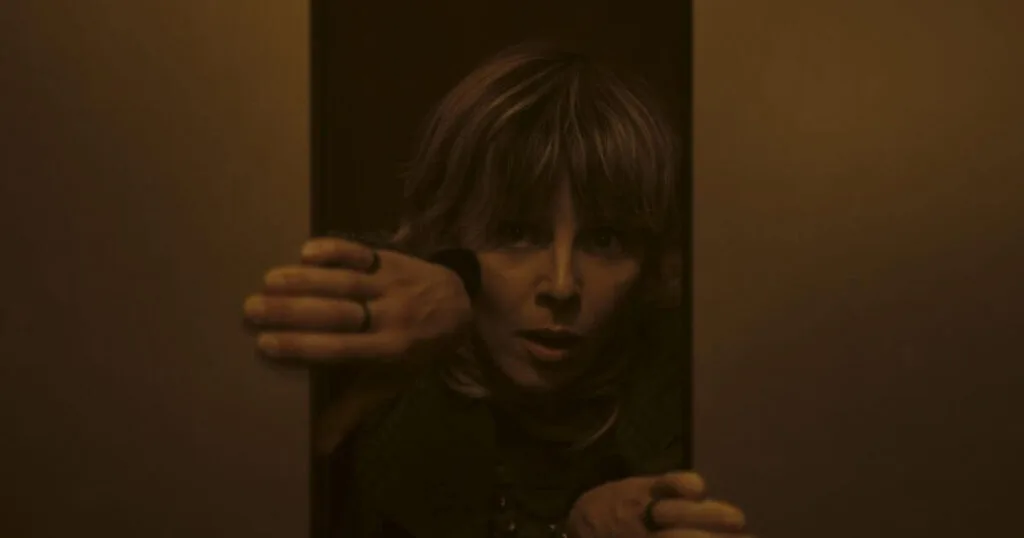 Photo still of Sophia Di Martino as Sylvie in Marvel Studios' LOKI, Season 2, episode 4, as she pries open an elevator.