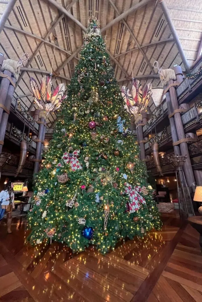 Photo of the main Christmas tree at Disney's Animal Kingdom Lodge Jambo House lobby.