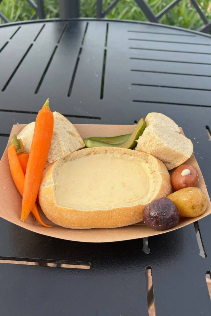 Photo of the cheese fondue with bread and veggies from the Bavaria Holiday Kitchen at Epcot.