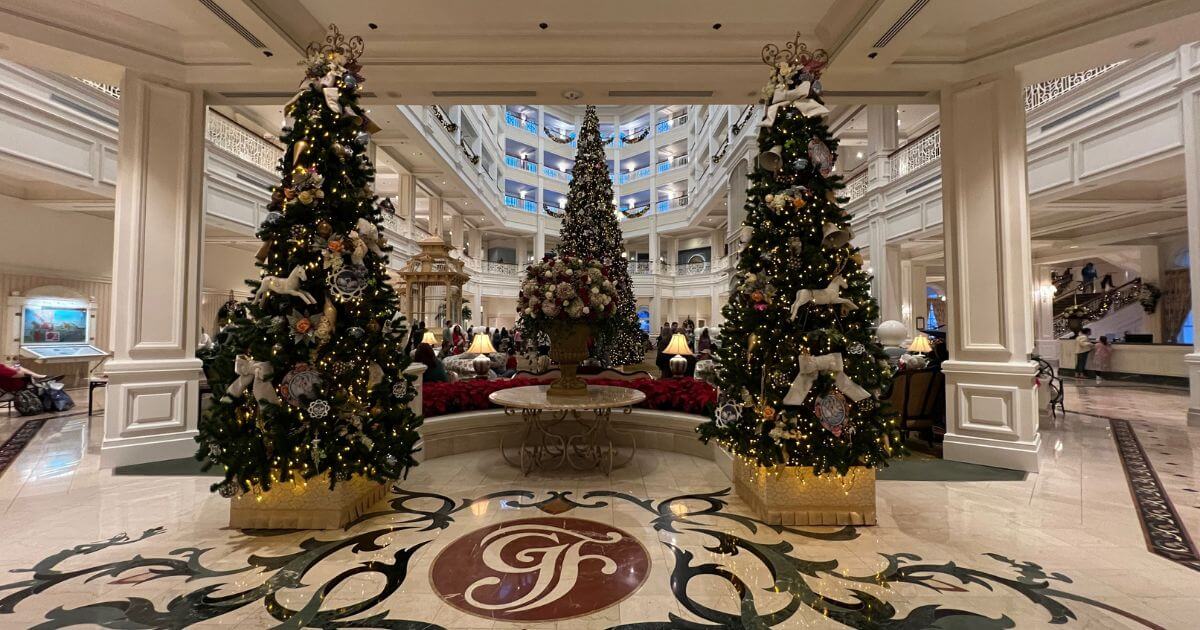 Photo of Christmas trees and decorations in the lobby of the Grand Floridian Resort at Disney World.