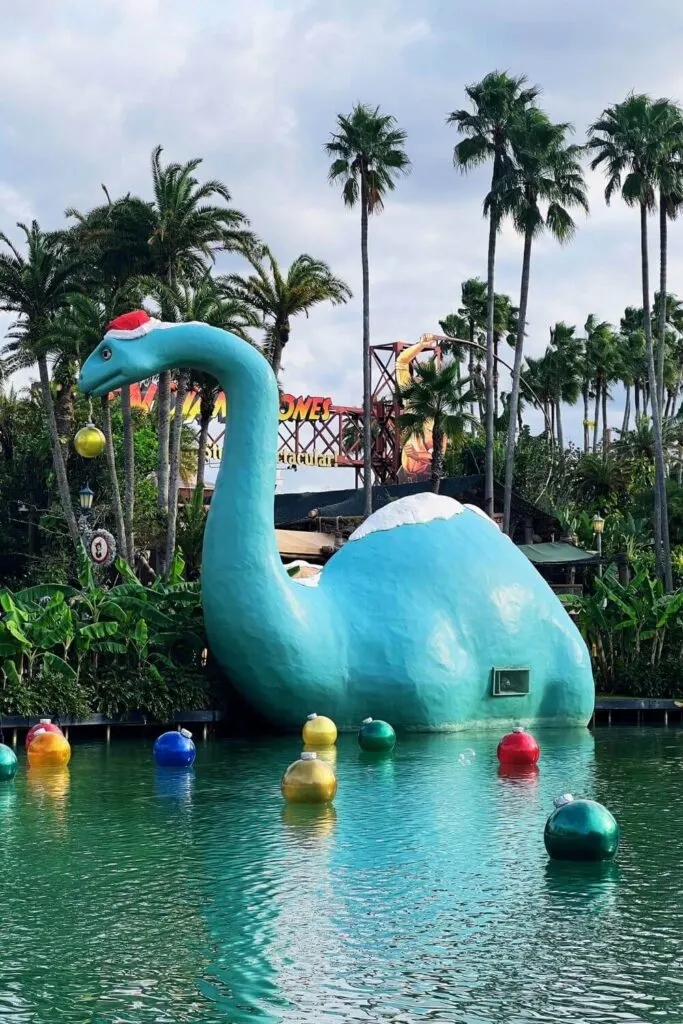 Photo of Santa Gertie at Hollywood Studios with Christmas baubles in the lake.