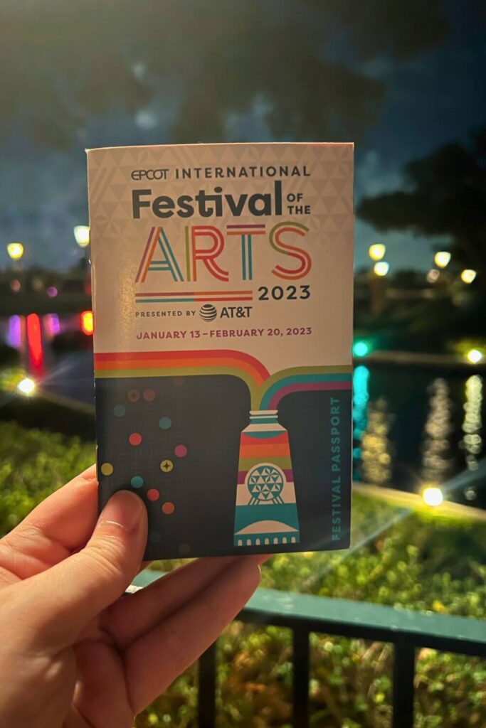 Photo of the passport for the Epcot International Festival of the Arts at night.