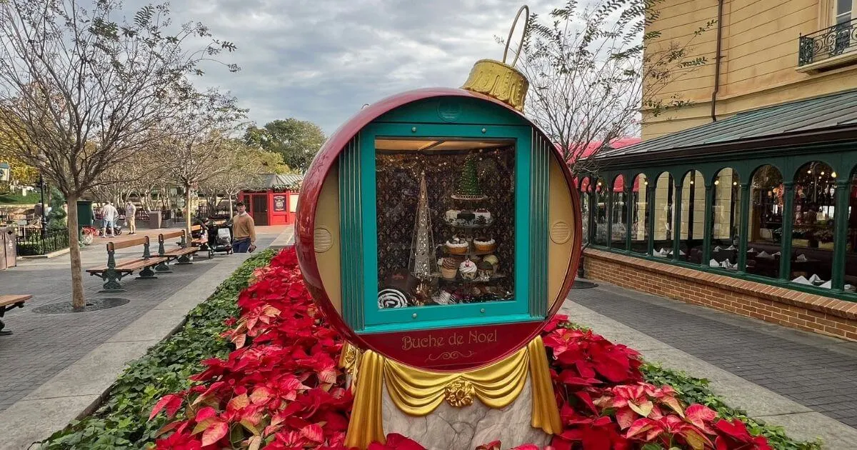 Photo of a diorama of French sweets inside a Christmas ornament at Epcot's France pavilion.