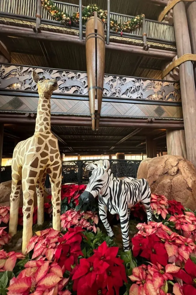 Photo of Gingeraffe and Debra the Zebra, gingerbread displays at the Animal Kingdom Lodge Jambo House lobby.