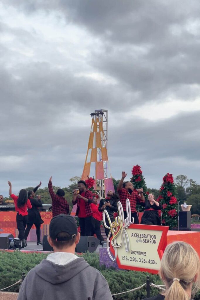 Photo of a group of singers performing Joyful! A Celebration of the Season at Epcot.