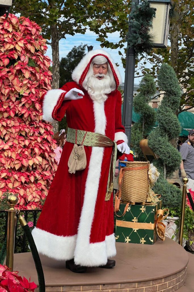 Photo of Pere Noel telling a story at the France pavilion during the Epcot Festival of the Holidays.