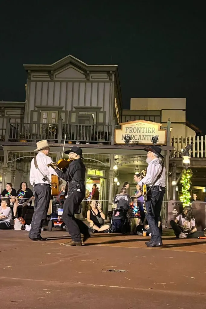 Photo of the Reindeer Wranglers musical trio that plays country/folk type music in Frontierland at Mickey's Very Merry Christmas Party.