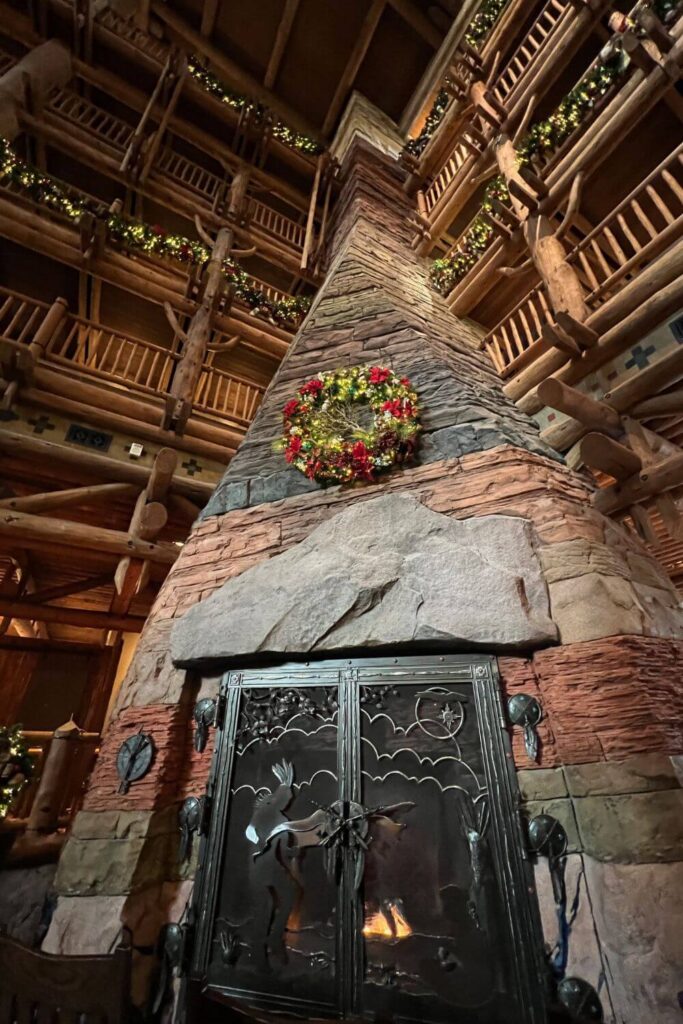 Photo of the 5+ story stone fireplace in the lobby of Disney's Wilderness Lodge resort.