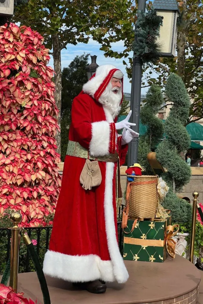 Photo of Pere Noel telling stories at the France pavilion in Epcot during the Christmas season.