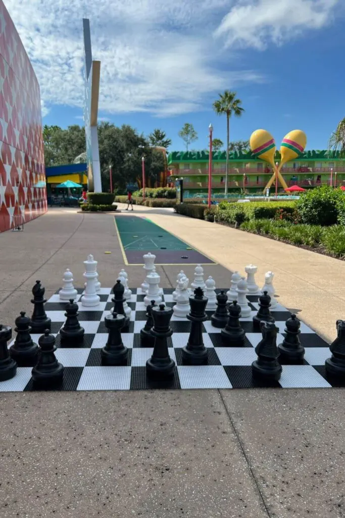 Photo of a life-sized chess board and pieces on the grounds of the All-Star Music Resort.