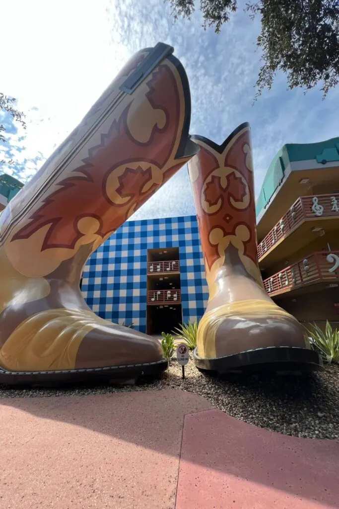 Photo of giant cowboy boots outside the hotel rooms in the Country Fair section of the All Star Music hotel.