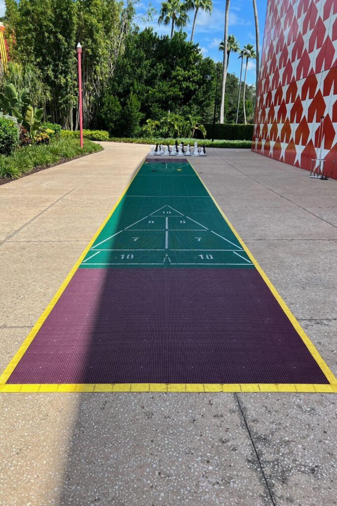 Photo of a shuffleboard court painted on the ground at All-Star Music Resort.