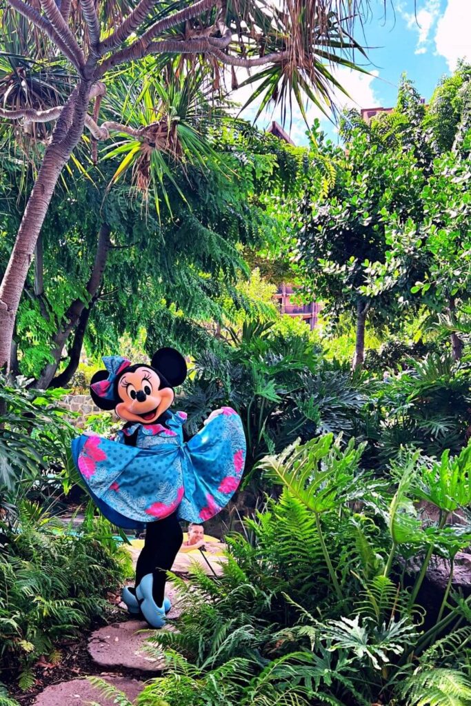Photo of Minnie Mouse posing while showing off her tropical dress at Aulani.