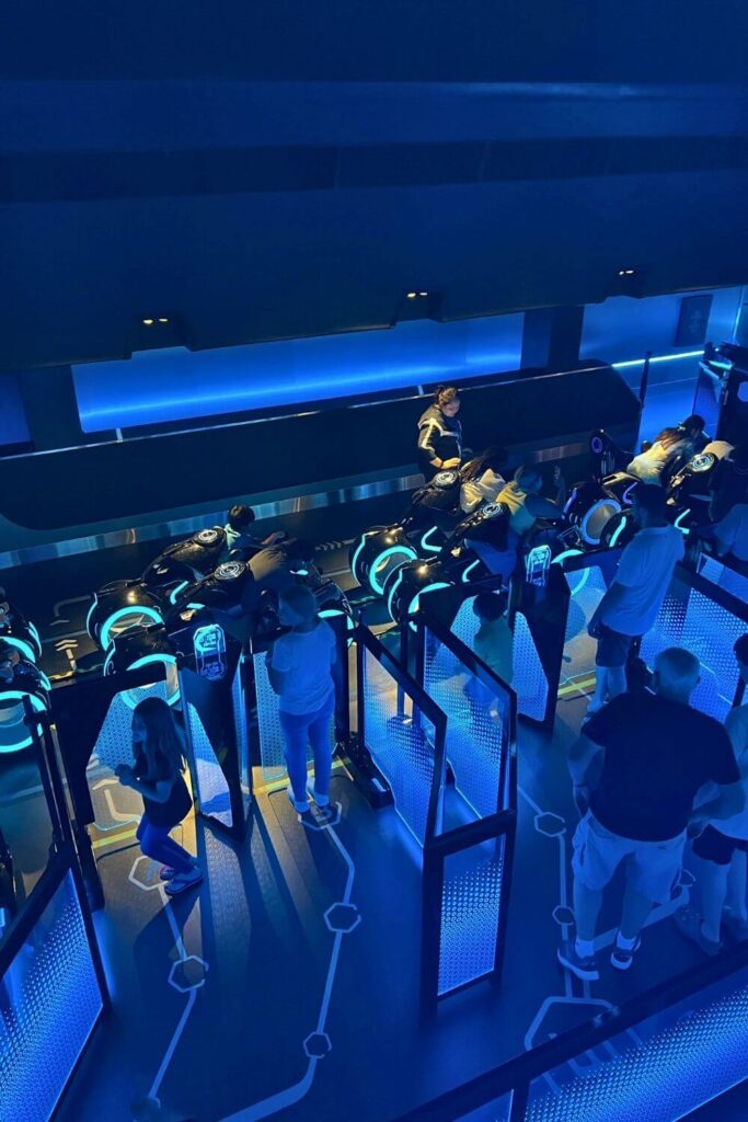 Photo looking down at the boarding area for TRON Lightcycle Run roller coaster.