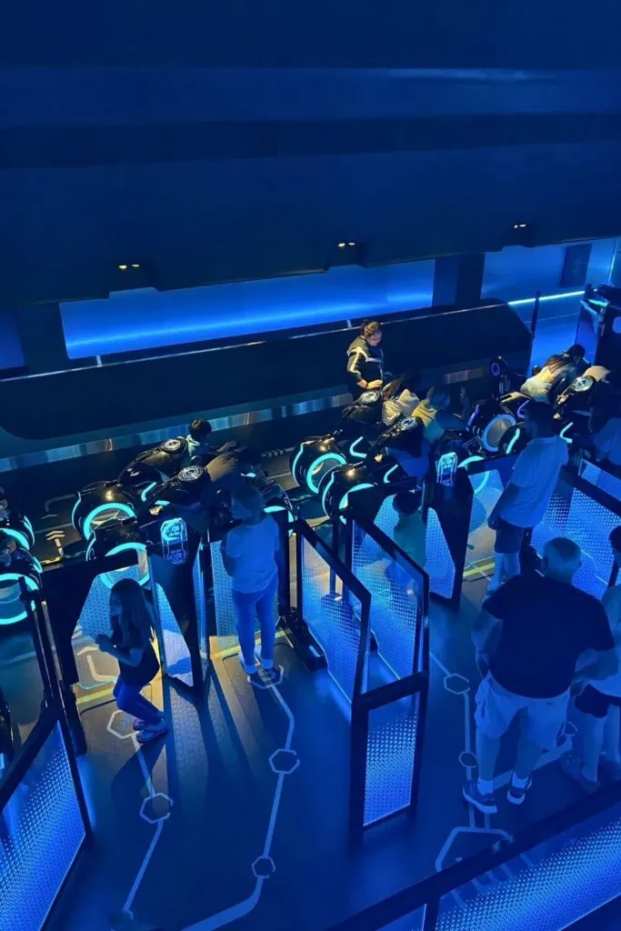 Photo looking down at the boarding area for TRON Lightcycle Run roller coaster.