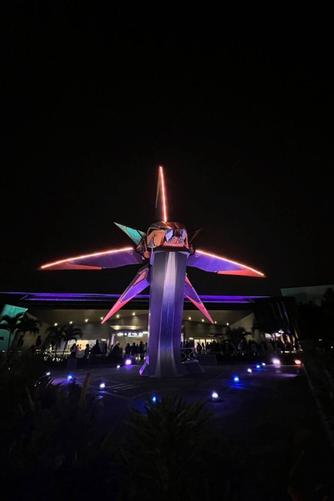 Photo of the starblaster space ship at night outside Guardians of the Galaxy: Cosmic Rewind roller coaster at Epcot.