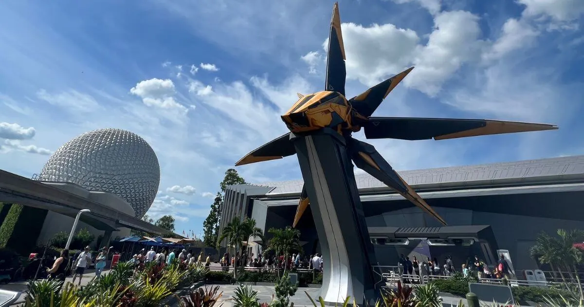 Photo of the plaza outside Cosmic Rewind with a starcruiser in the foreground and Spaceship Earth and the monorail in the background.