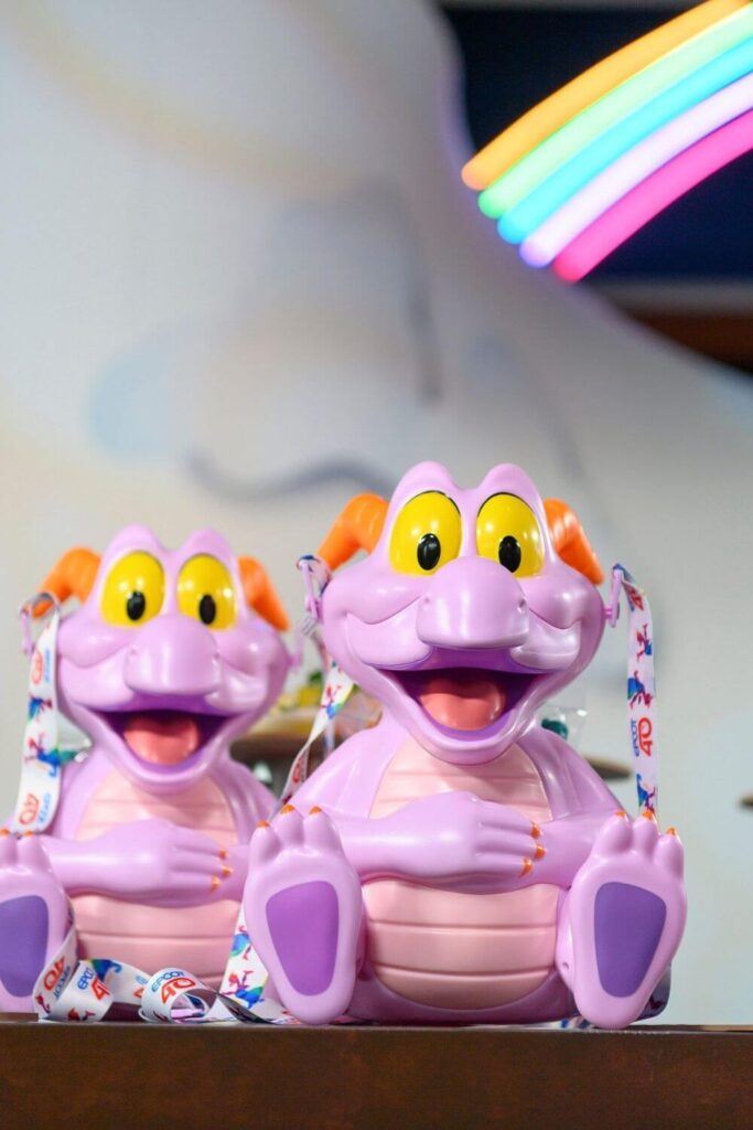 Photo of a group of Figment popcorn buckets at Epcot Festival of the Arts.