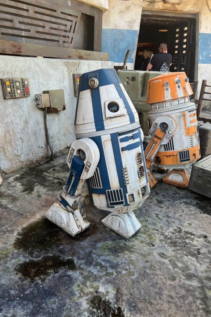 Photo of 2 droids parked outside in Star Wars: Galaxy's Edge.