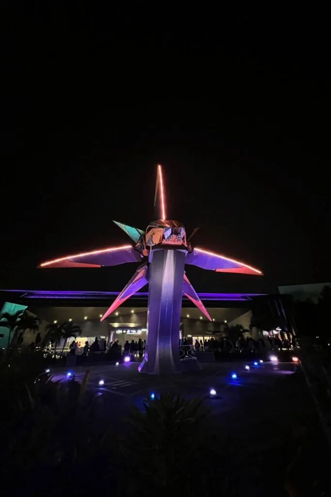 Photo of the starcruiser outside Cosmic Rewind at night.