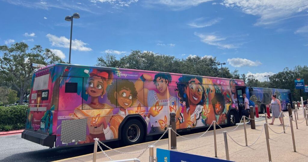 Photo of a resort bus with characters from Encanto wrapped on the side.