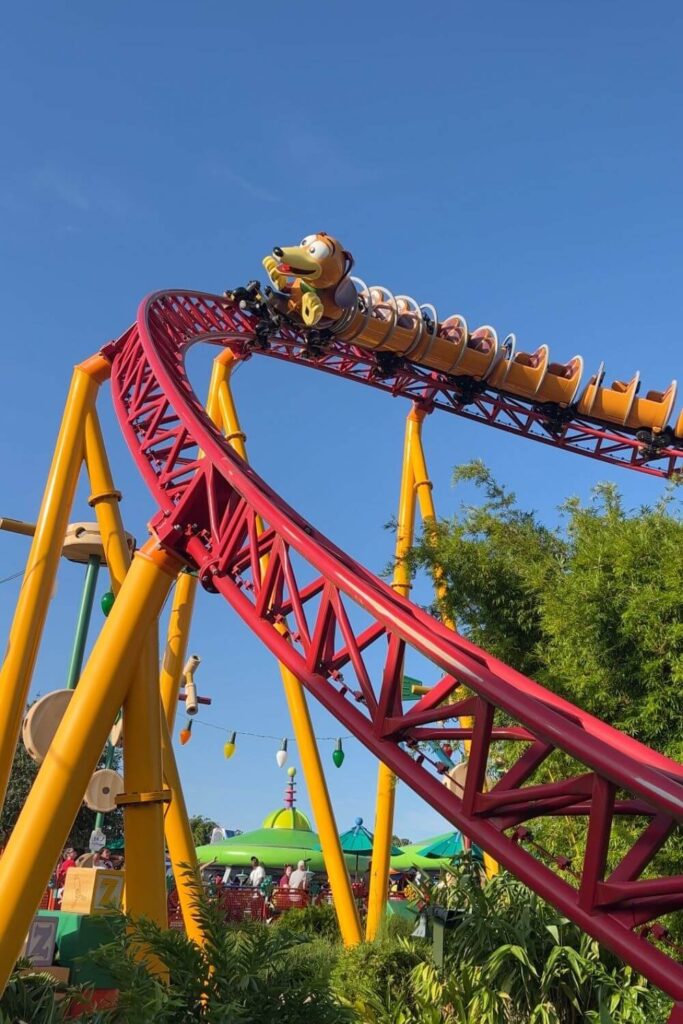 Photo of Slinky Dog Dash roller coaster, with Slinky turning a curve to go down a hill.