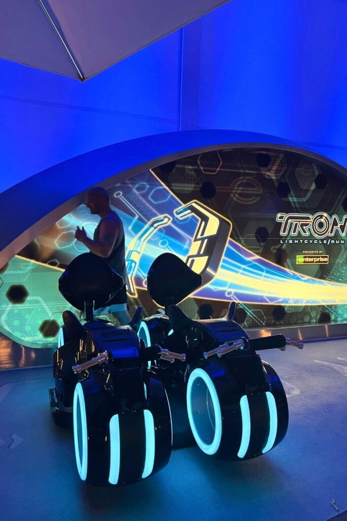 Photo of tester seats outside the queue entrance for TRON Lightcycle Run roller coaster.