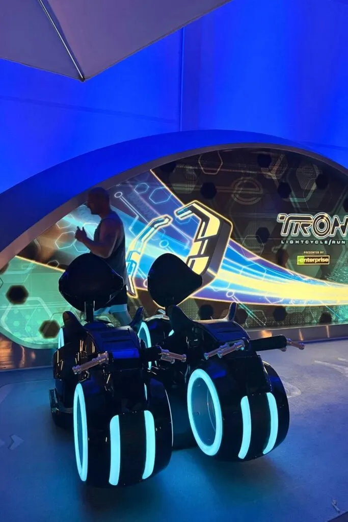 Photo of tester seats outside the queue entrance for TRON Lightcycle Run roller coaster.