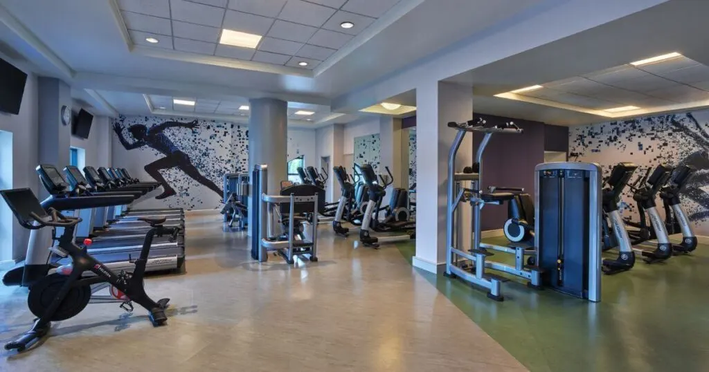 Photo of the Dolphin Health Club at the Walt Disney World Dolphin Resort with a Peloton bike in the foreground.