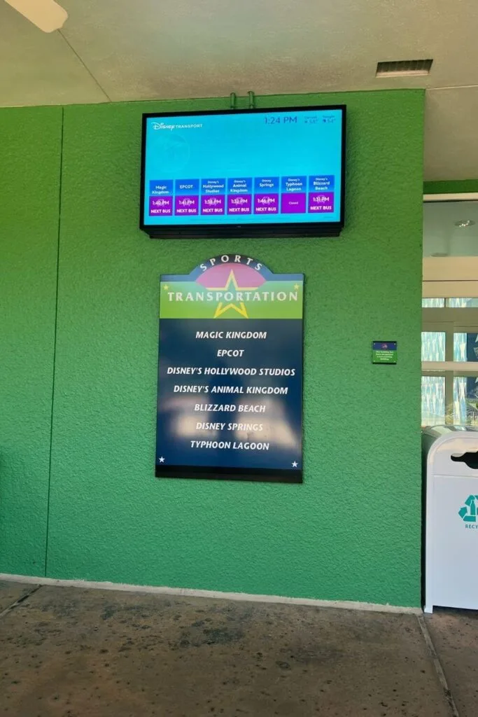 Photo of a display screen showing bus transportation times at Disney World.