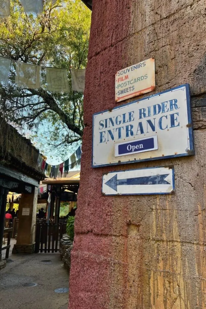 Photo of a sign at Expedition Everest in Animal Kingdom that reads: Single Rider Entrance Open, with an arrow pointing toward the entrance.