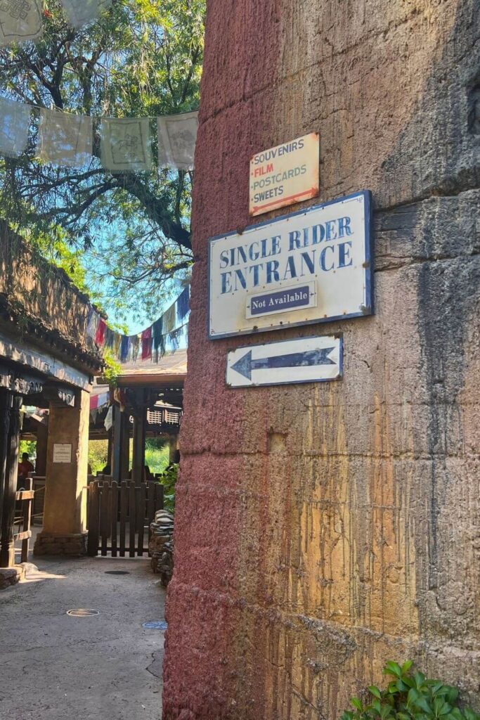 Photo of a sign at Expedition Everest in Animal Kingdom that reads: Single Rider Entrance Not Available, with an arrow pointing toward the entrance.