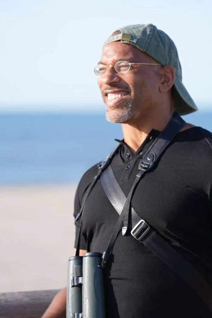 Christian Cooper surveys the beach at Fort Tilden in the National Geographic show, Extraordinary Birder with Christian Cooper.
