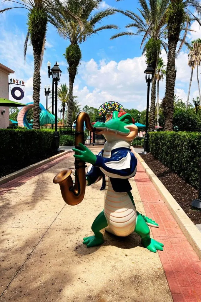 Photo of one of a saxophone-playing alligator statue at Port Orleans French Quarter in Disney World.