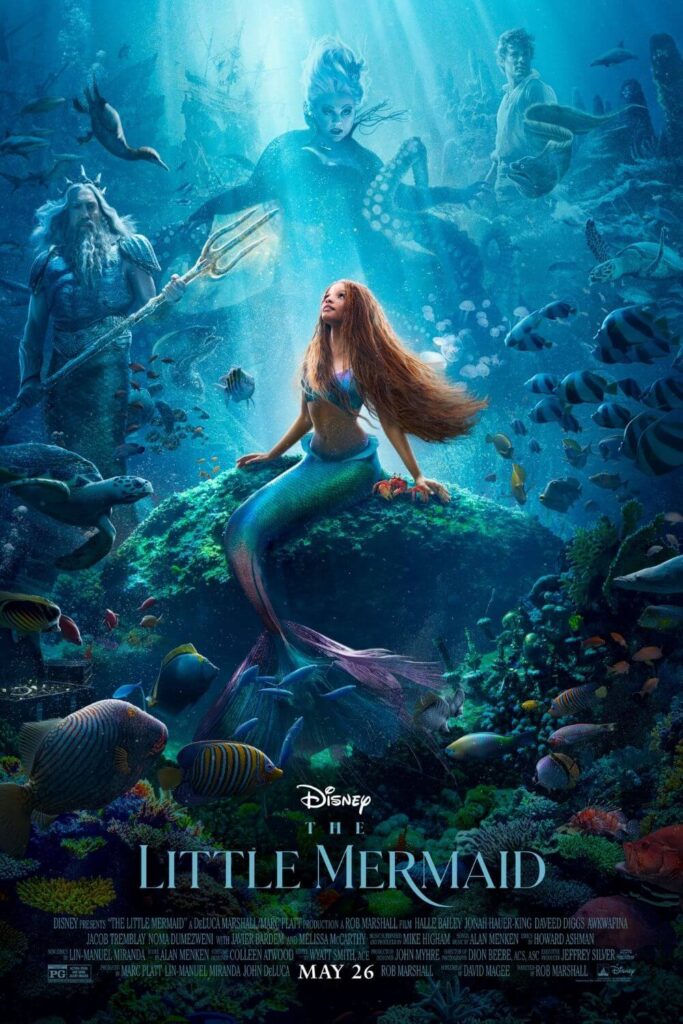 Promotional poster for the 2023 live-action remake of The Little Mermaid, with Ariel sitting on a rock under the sea and supporting characters in the background.