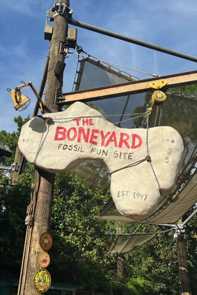 Photo of signage for the Boneyard Fossil Fun Site sandbox in DinoLand USA.