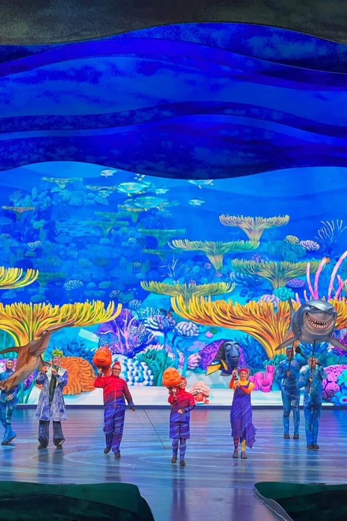 Photo of the encore scene from the Finding Nemo show at Animal Kingdom, with all the main actors and puppets on the stage.