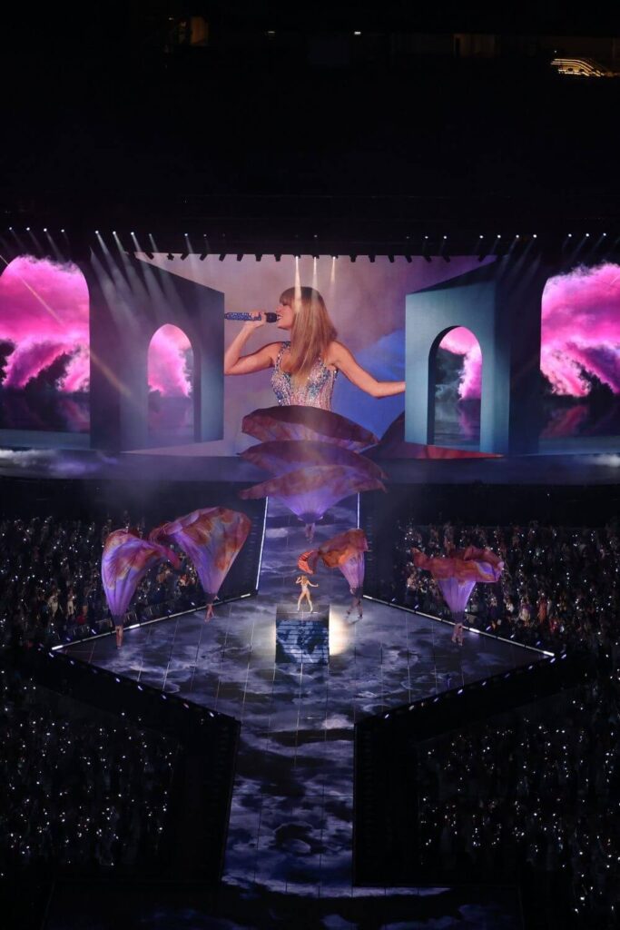 Photo of the opening set of the Eras Tour, with Taylor Swift performing a song from Lover.