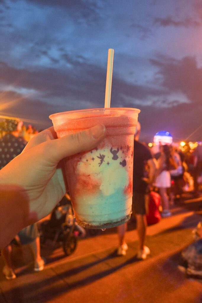 Photo of the red, white, and blue layered slushy-soft serve combo at Epcot.