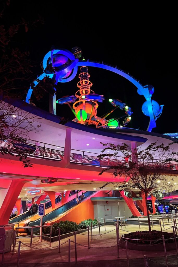 Photo of People Mover and Astro Orbiter at night in Disney World's Magic Kingdom theme park.