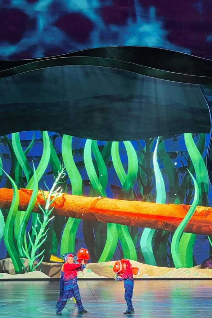 Photo of Nemo and Marlin puppets and puppeteers performing in Animal Kingdom's show, Finding Nemo: The Big Blue...and Beyond!