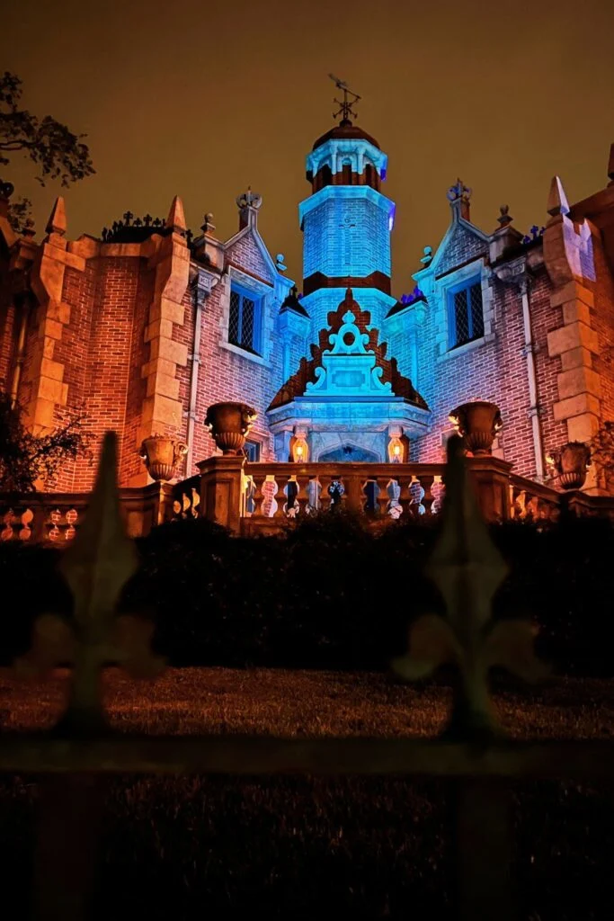 Photo of the Haunted Mansion building at Magic Kingdom at night.
