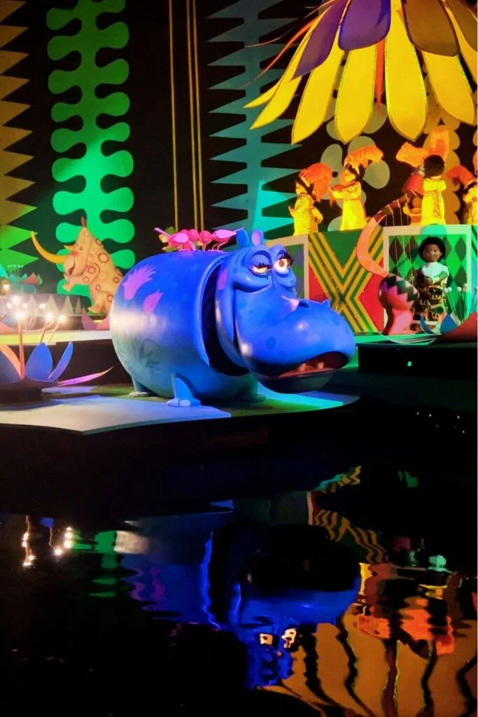 Photo of the winking hippo on It's a Small World at Magic Kingdom, reflecting in the water of the ride.