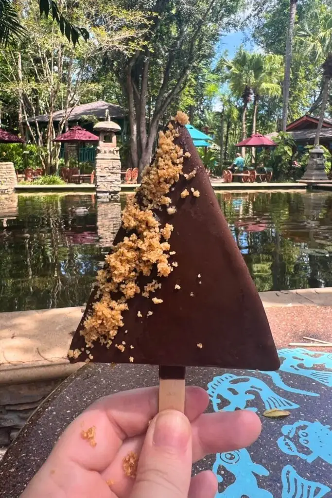 Photo of the key lime pie pop from Flame Tree Barbecue, with a chocolate coating and graham cracker crumbles.