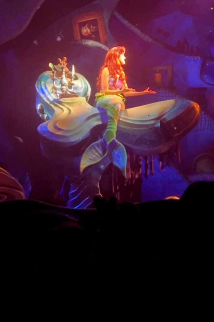 Photo of a scene from the Hollywood Studios show, The Little Mermaid: A Musical Adventure, featuring Ariel singing "Part of Your World."