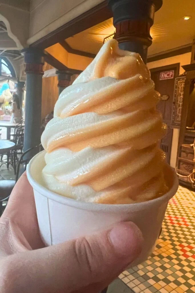 Photo of a cup of orange and vanilla soft serve swirl from Sunshine Terrace.