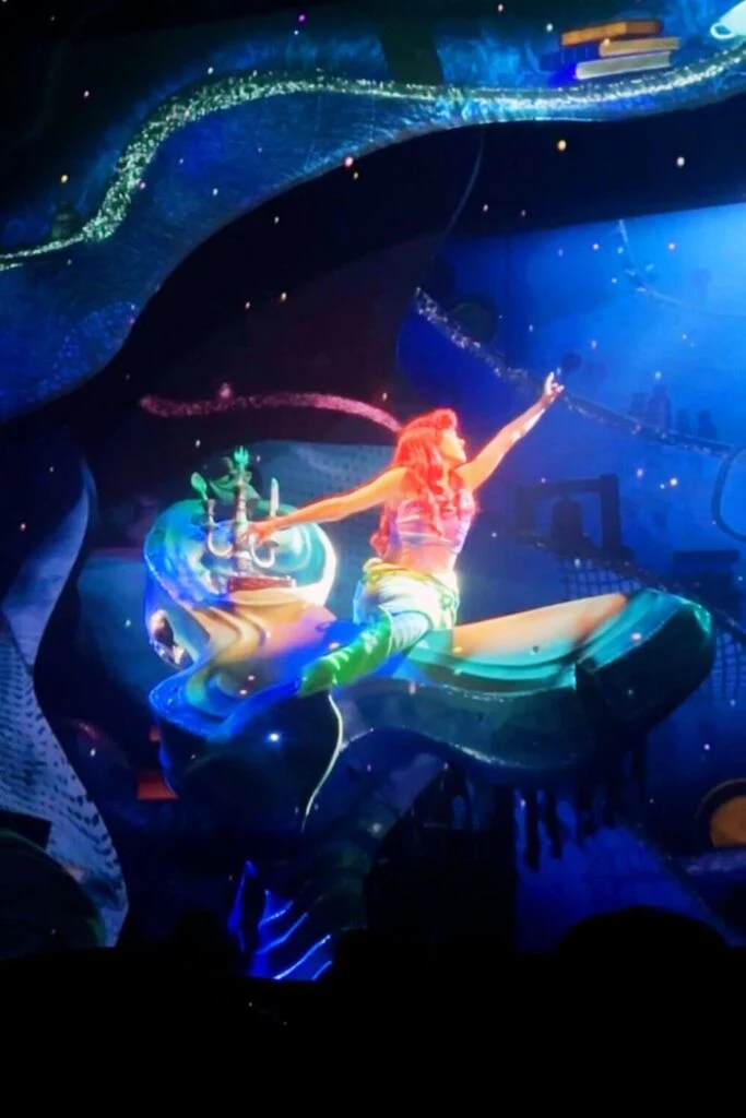 Photo of Ariel singing during the Little Mermaid: A Musical Adventure show at Hollywood Studios.