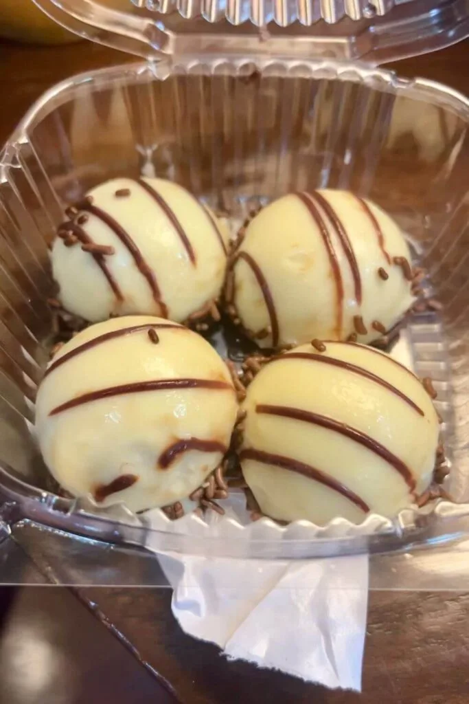 Closeup of an order of 4 zebra domes, a boozy chocolate truffle.